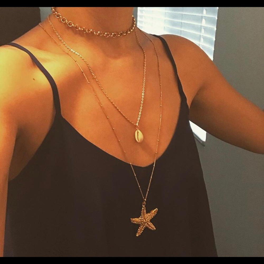 Gold layered necklace pendant shell star